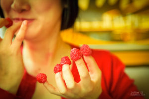 Amelie inspired photoshoot Amelie costume Montmartre Paris France travel cosplay Eating raspberries off fingers Cafe des deux moulins